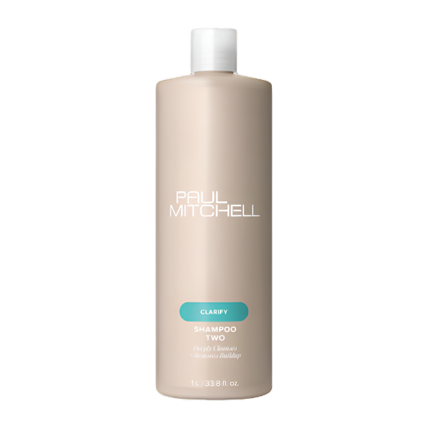 A bottle of PAUL MITCHELL CLARIFYING Shampoo clarifying and deeply cleaning hair.