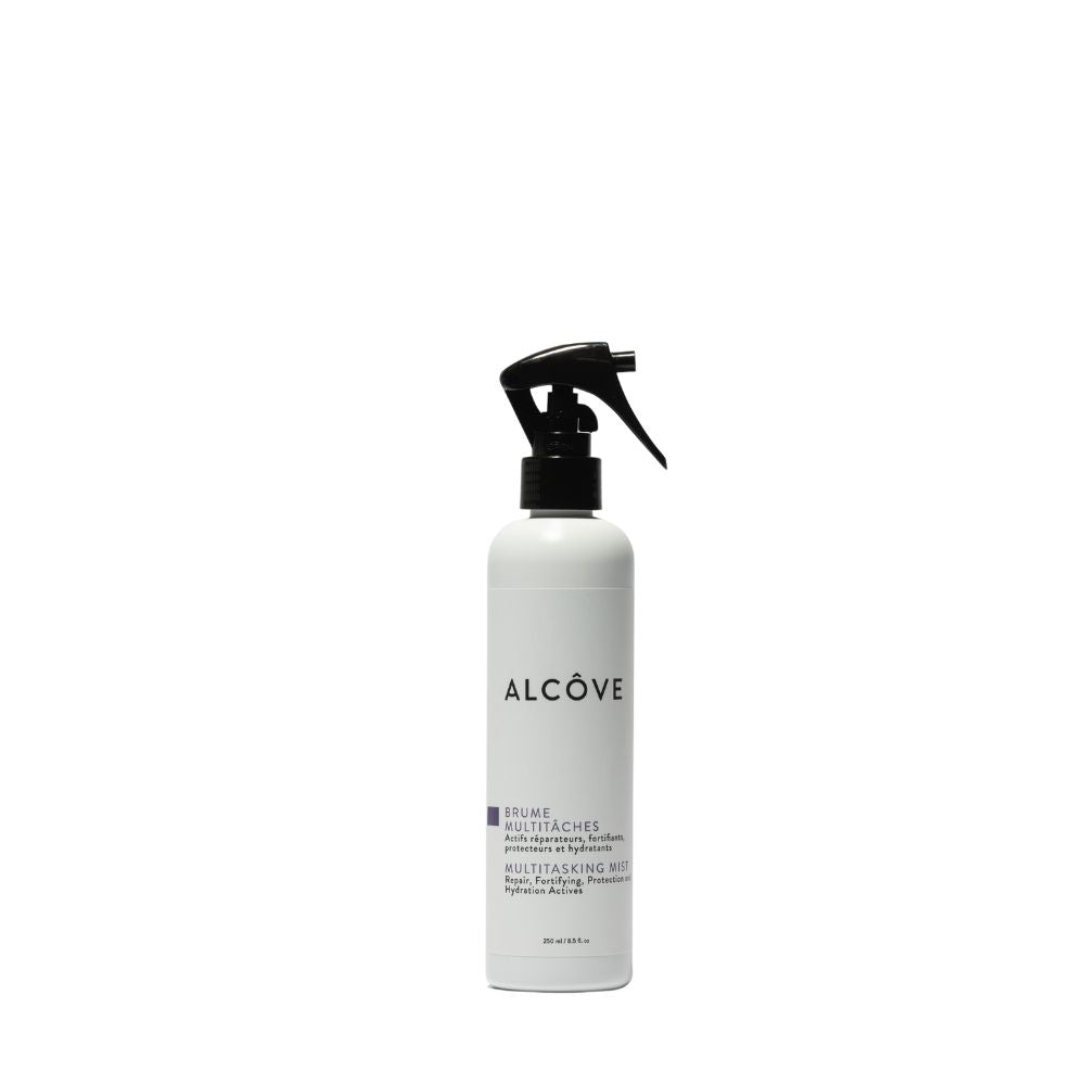 A white spray bottle with black text labeled 'ALCOVE' with additional text that appears to be a description or branding information.