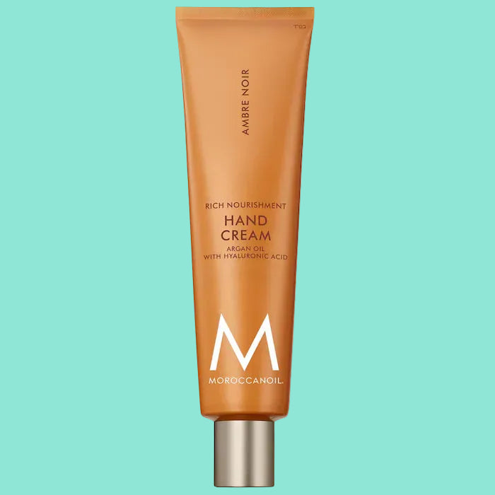Moroccanoil hand cream tube on a white background