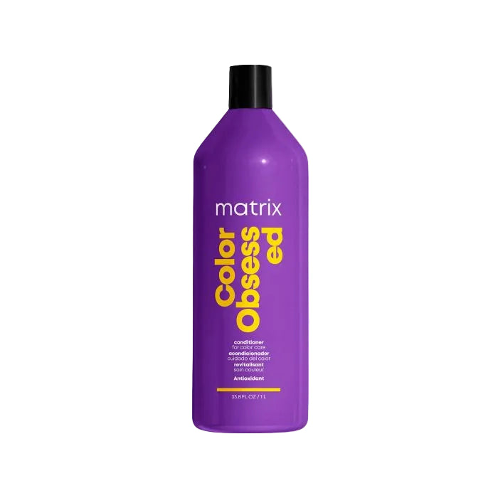 Purple bottle of Matrix Color Obsessed conditioner on a white background