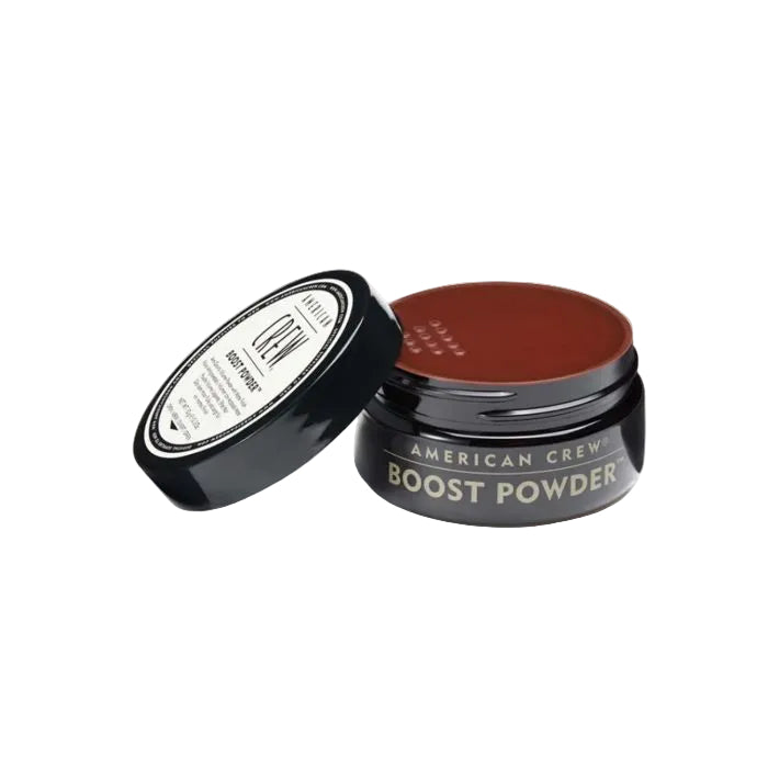 American Crew Boost Powder jar with brown powder on a white background