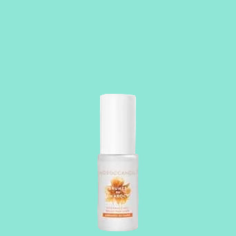 White bottle with orange label on a white background