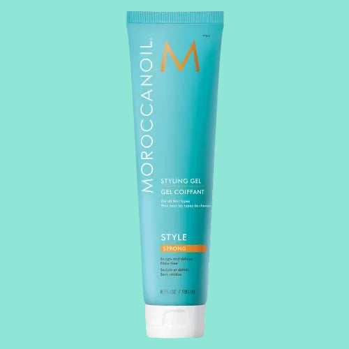 A tube of Moroccanoil Styling Gel Strong Hold with a blue label, argan oil-infused, and alcohol-free.