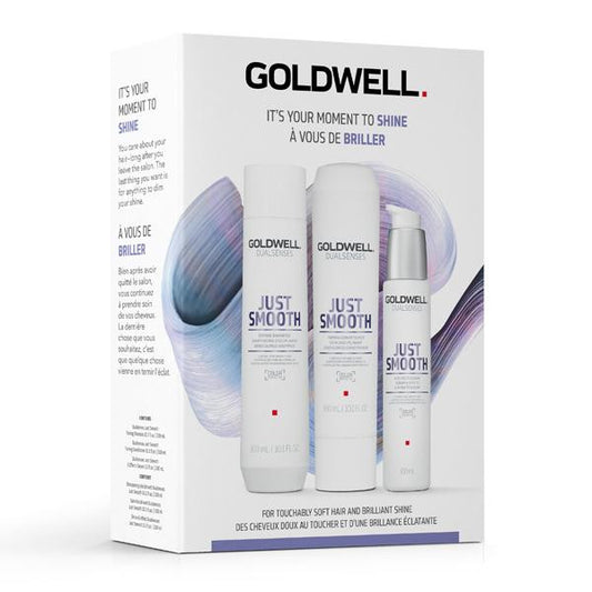 Goldwell Dualsenses Just Smooth Set packaging, featuring three bottles of hair care products: a shampoo, a conditioner, and a serum, with a white and purple design on the packaging.