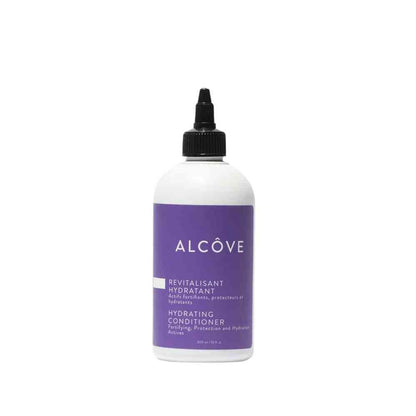 A bottle of Alcôve hydrating conditioner with a white label and purple text.