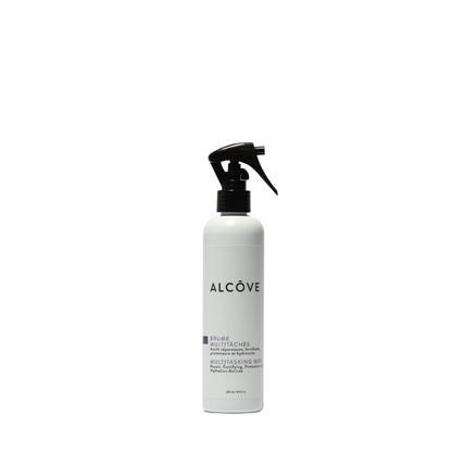 A white spray bottle with black text labeled 'ALCOVE' with additional text that appears to be a description or branding information.