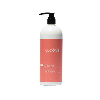 A bottle of Alcôve volumizing conditioner with a white label and pink text.