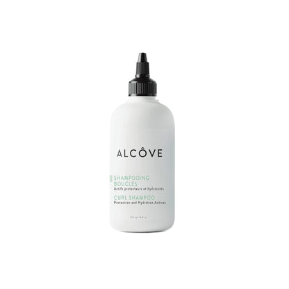 White shampoo bottle with black cap labeled 'Alcçove' on a white background