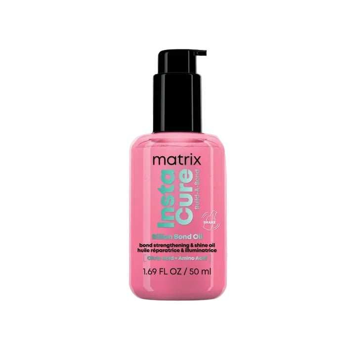 Pink bottle of Matrix Insta Cure oil on