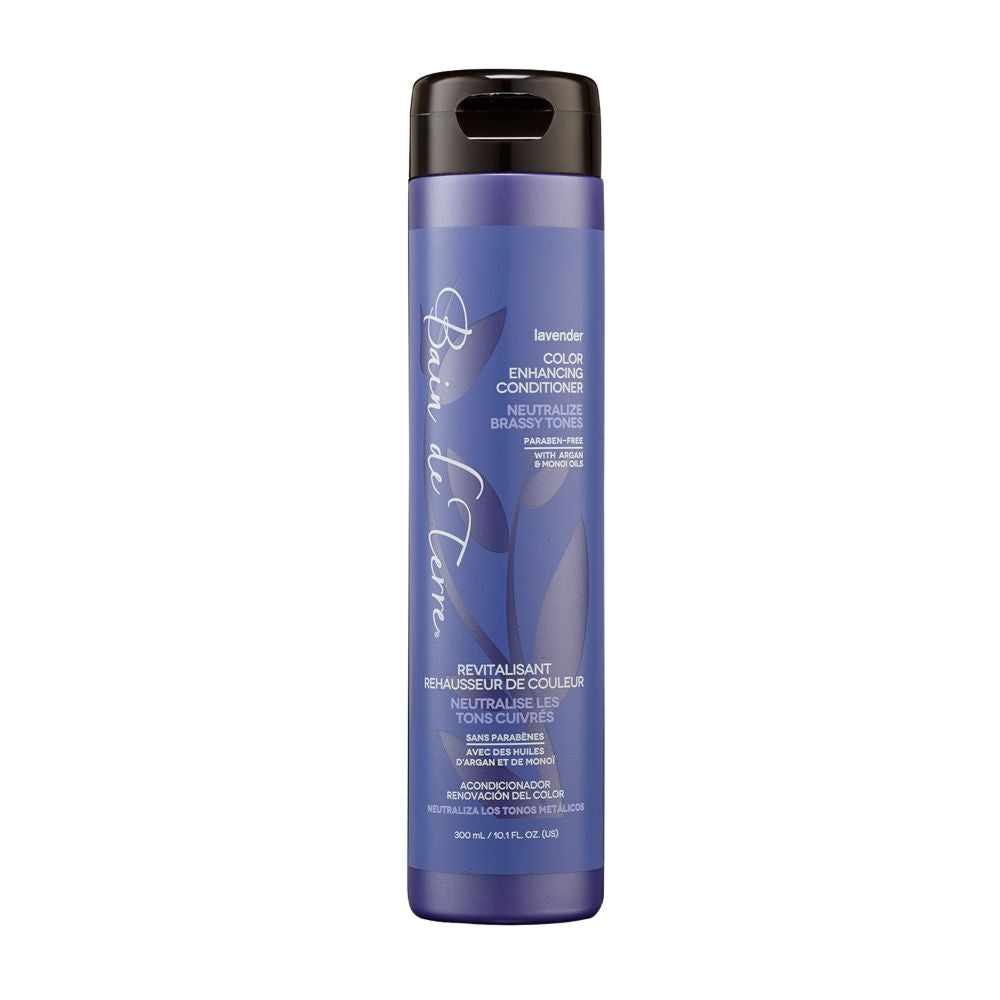 Purple bottle of hair conditioner with black cap on a white background