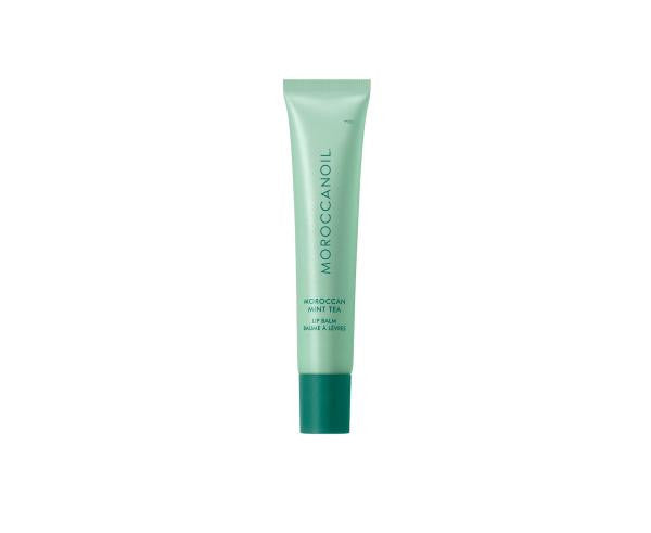 Green tube of Moroccanoil product on a white background