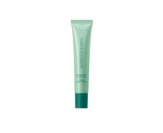 Green tube of Moroccanoil product on a white background