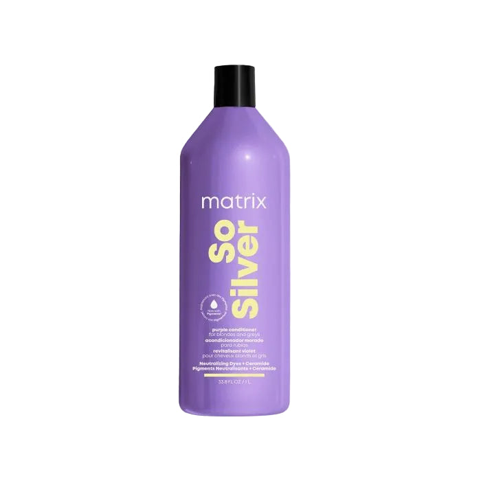 Purple bottle of Matrix So Silver conditioner on a white background