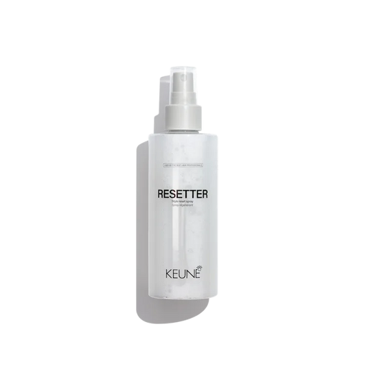 Keune Resetter spray bottle on a white background