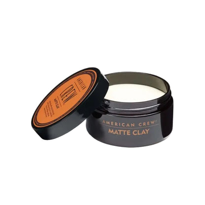 American Crew Matte Clay jar with open lid on a white background