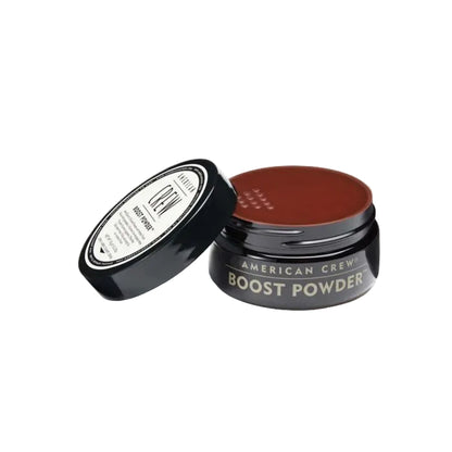 American Crew Boost Powder jar with brown powder on a white background