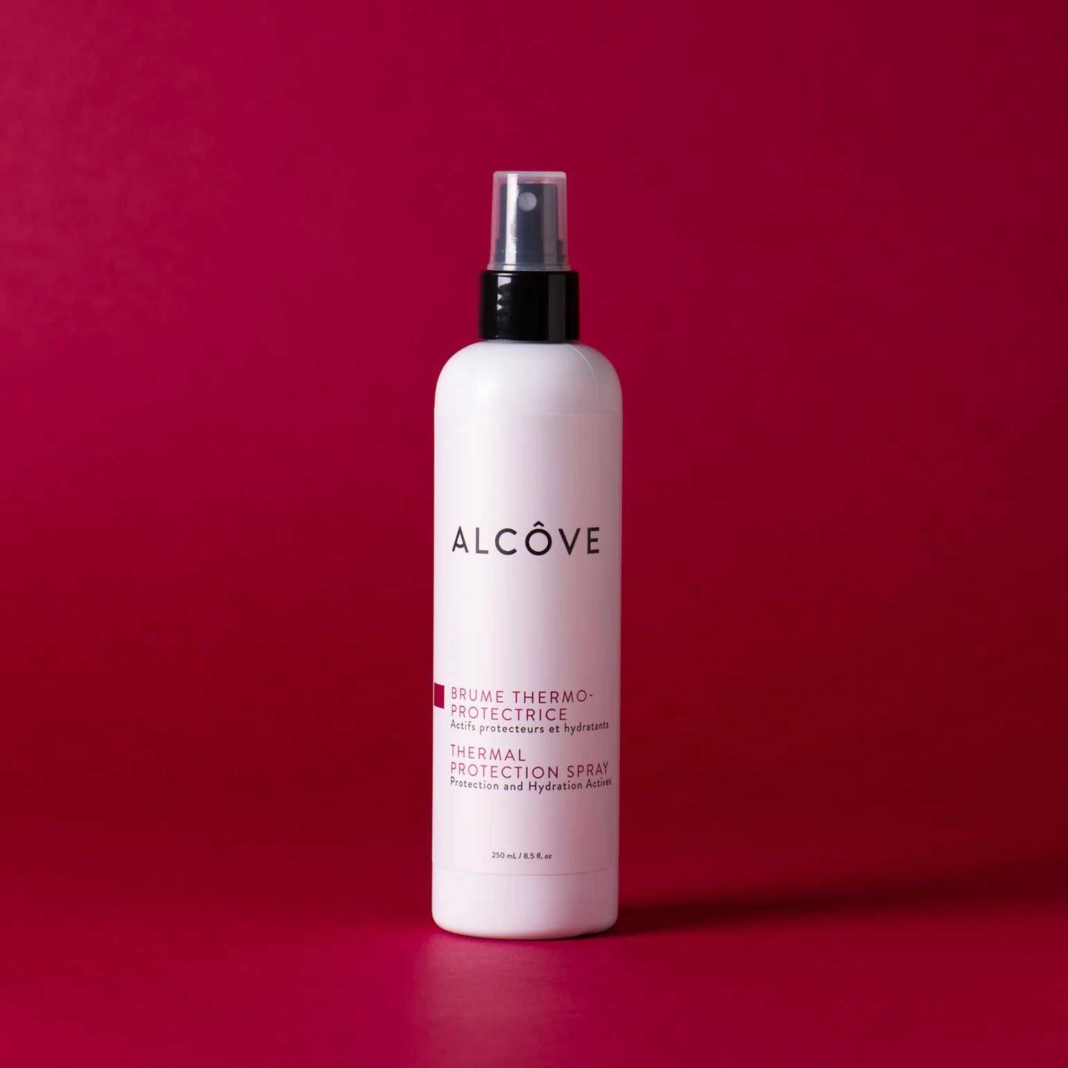 Alcove thermal protection spray bottle on a red background